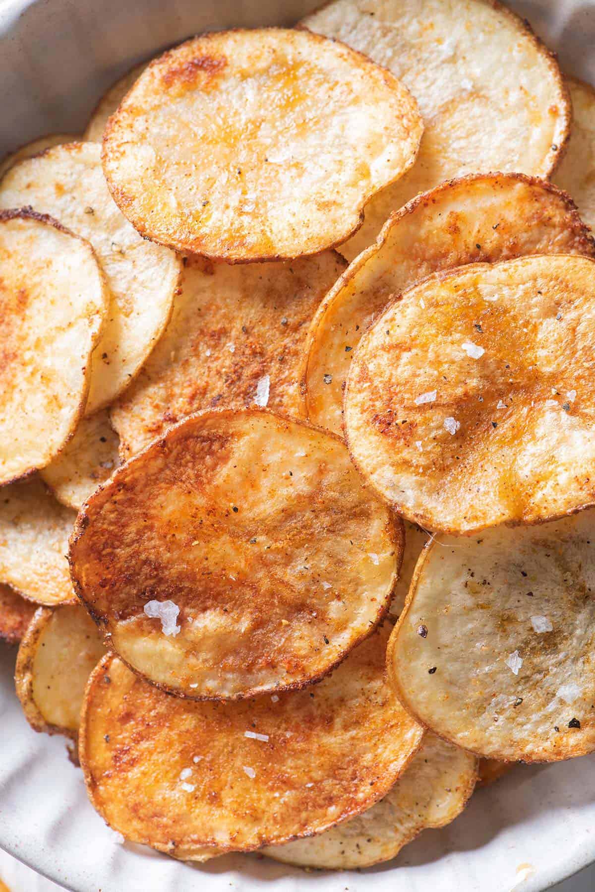 Close up shot of the oven baking potato chips to show the texture