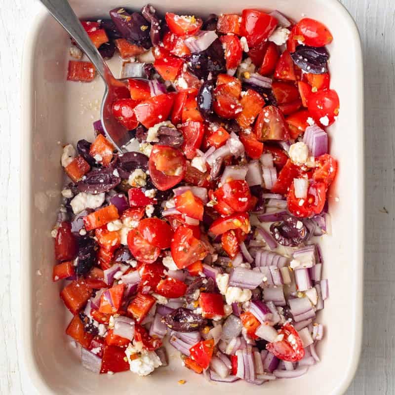 After mixing the veggies, feta, and spices together.