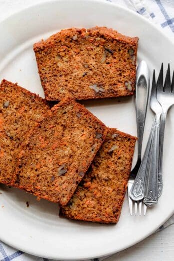 Carrot banana bread on a large white plate with small forks