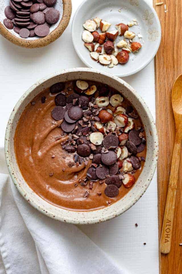 Chocolate hazelnut smoothie bowl with chopped hazelnuts and chocolate chips