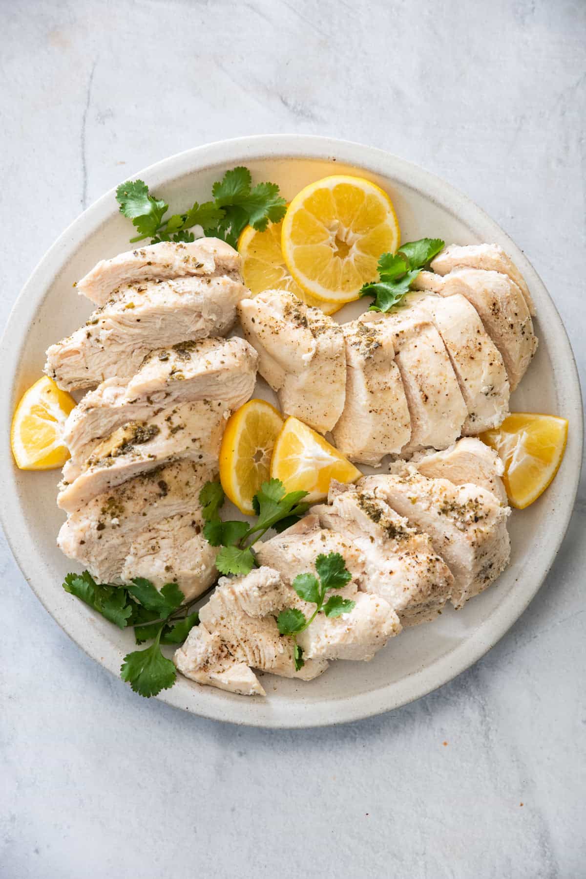 Plate of cooked chicken breast that was cooked in instant pot
