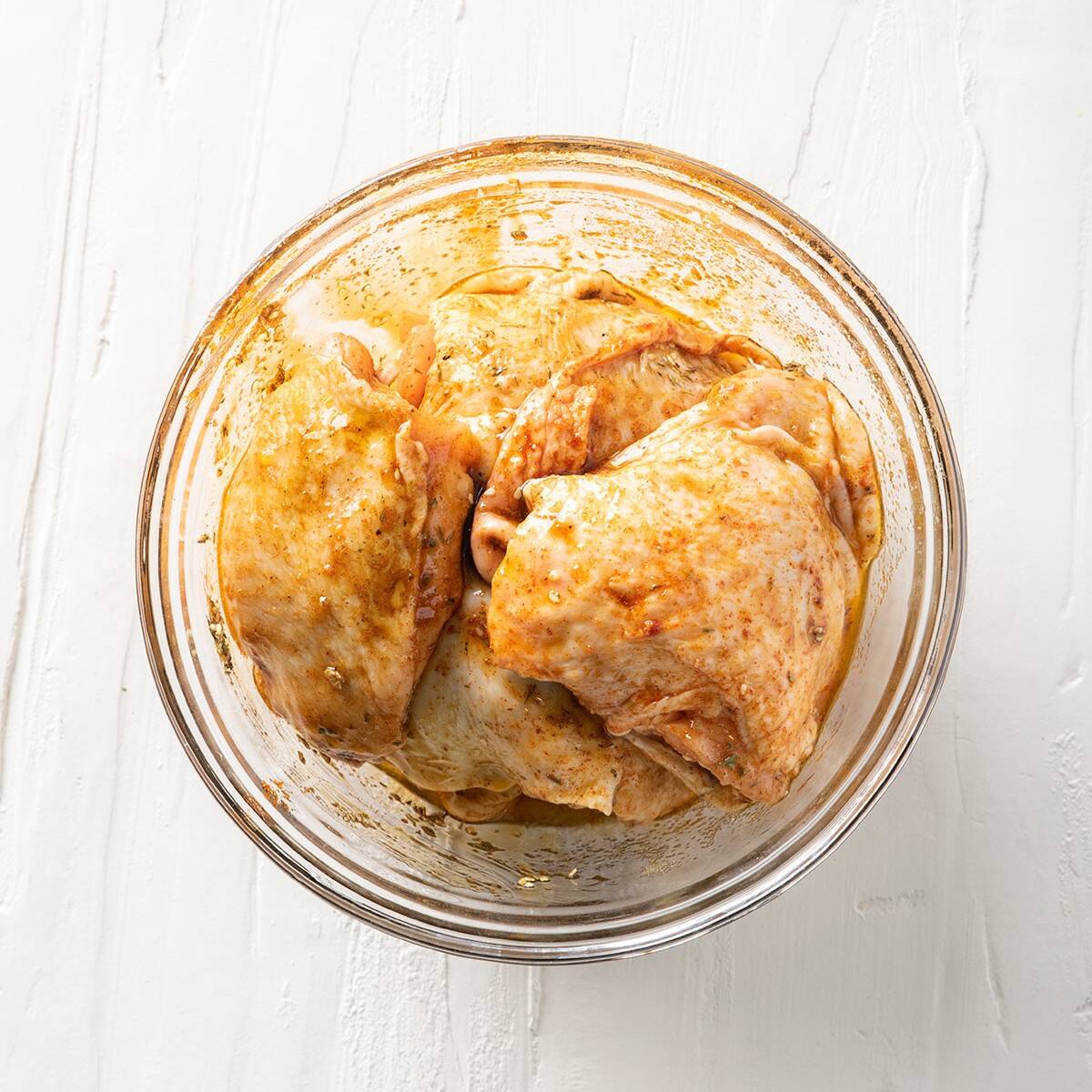 Chicken in the bowl after mixing with the sauce.