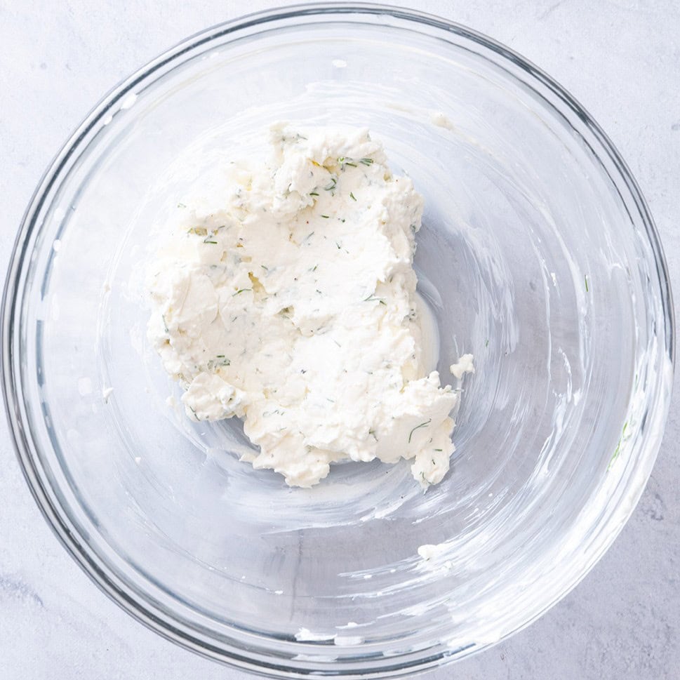 Cream cheese spread ingredients in a bowl after mixing.