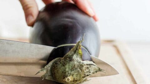 Cut Greens With Sharp-edged Eggplant Slicer 