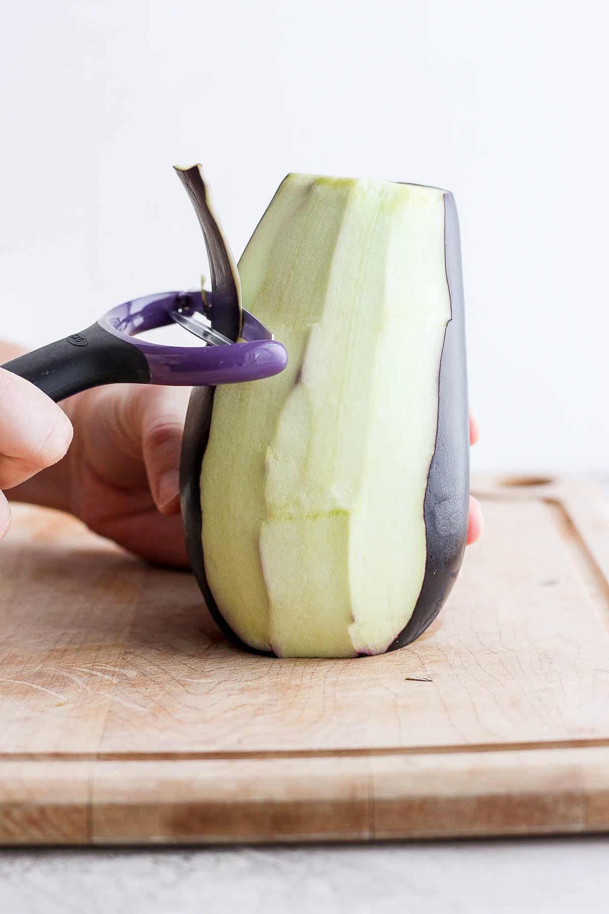 Peeling eggplant with wide peeler