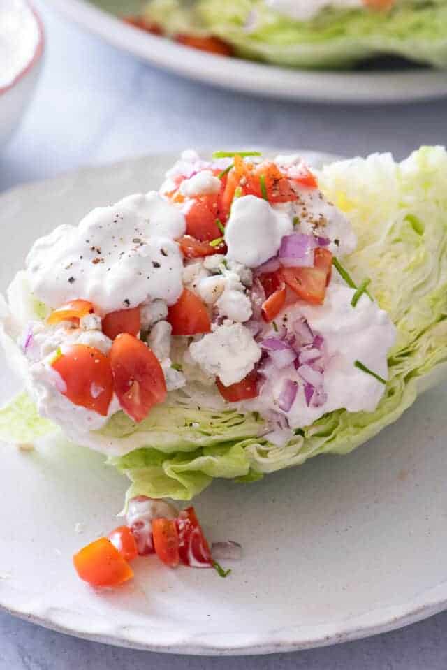 Close up shot of the wedge salad with the toppings