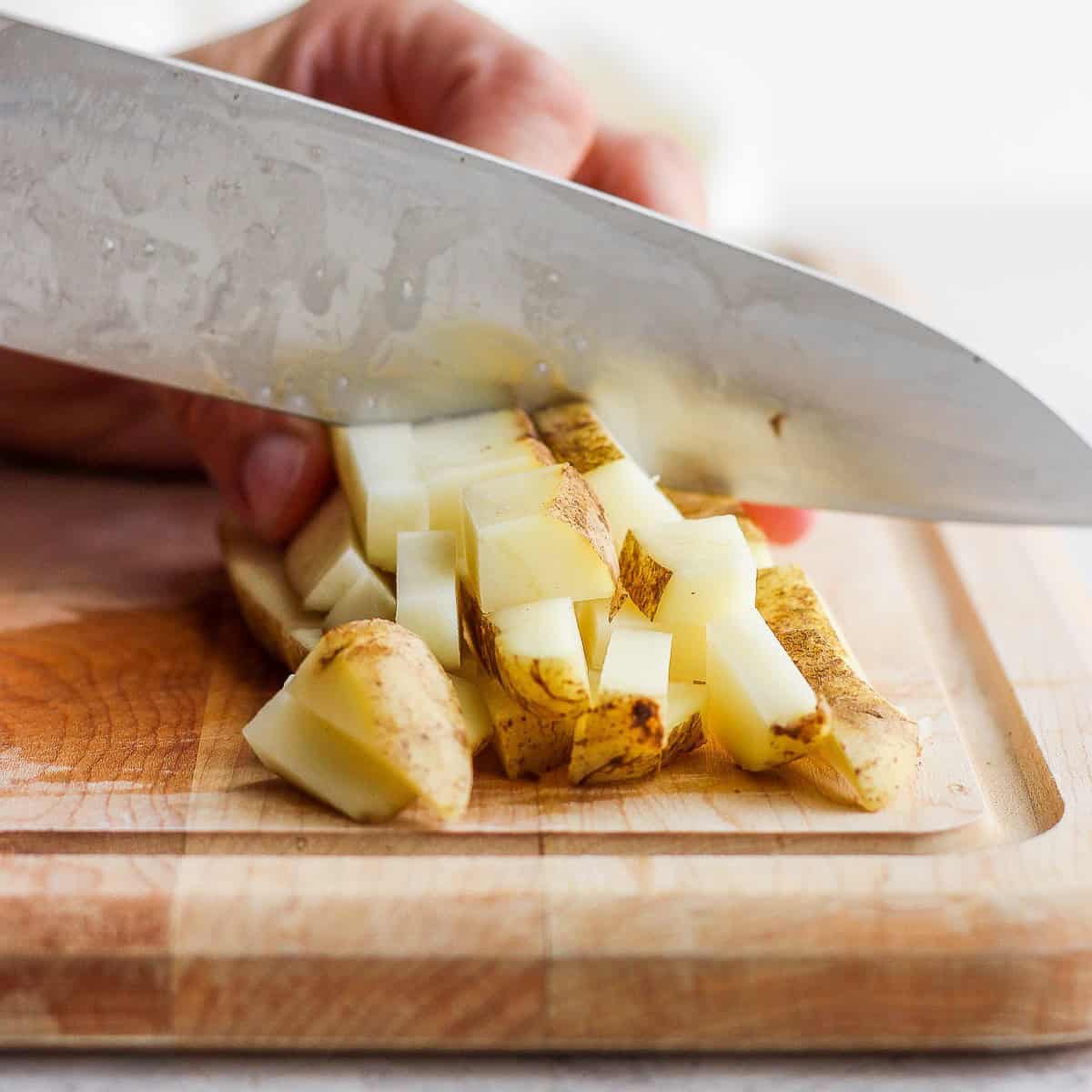 Continued dicing of the potato.