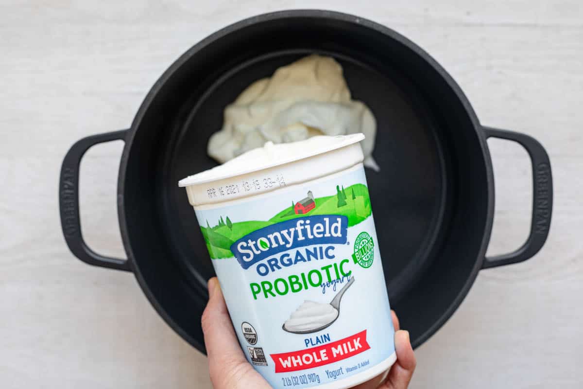 Stonyfield yogurt getting poured into pot