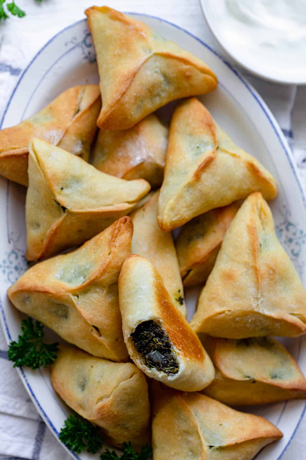 close up of spinach pies on a plate