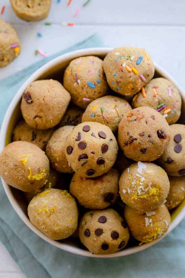 Large bowl of protein bites with two on the side