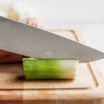 Knife cutting leeks