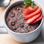 Vegan chocolate mug cake topped with strawberries