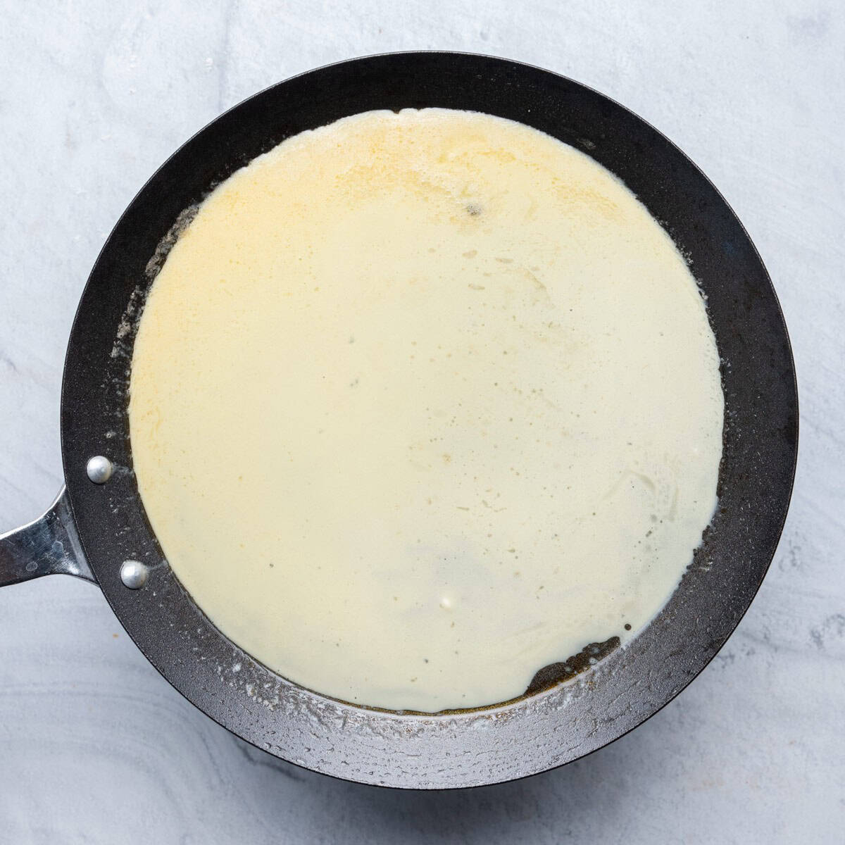 Swirling pan to distribute.