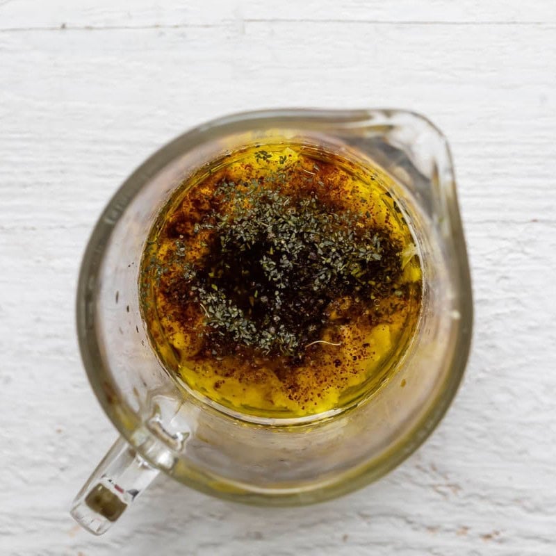 Ingredients for the dressing in a measuring cup before mixing.