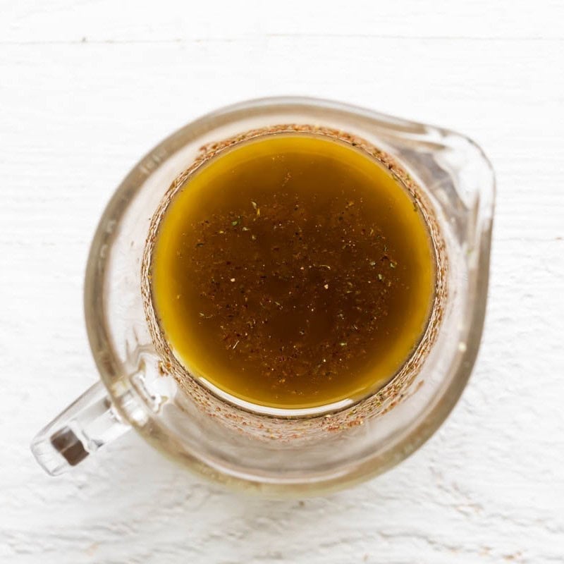 Ingredients for the dressing in a measuring cup after mixing.