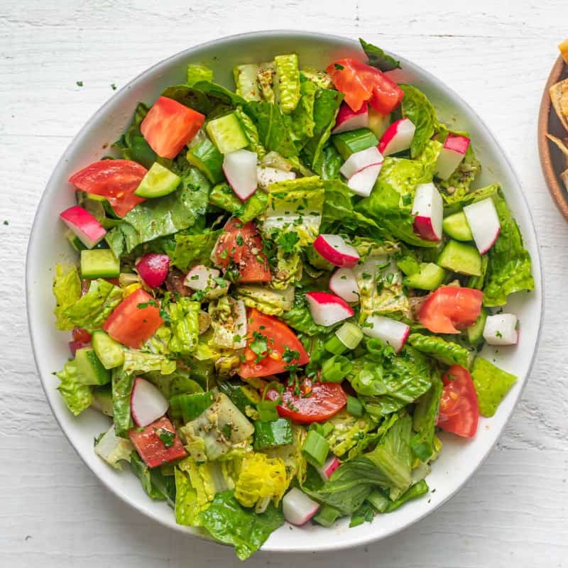 Ingredients for the salad in a bowl after mixing together.