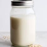 Oat milk in a glass jar.