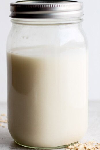 Oat milk in a glass jar.