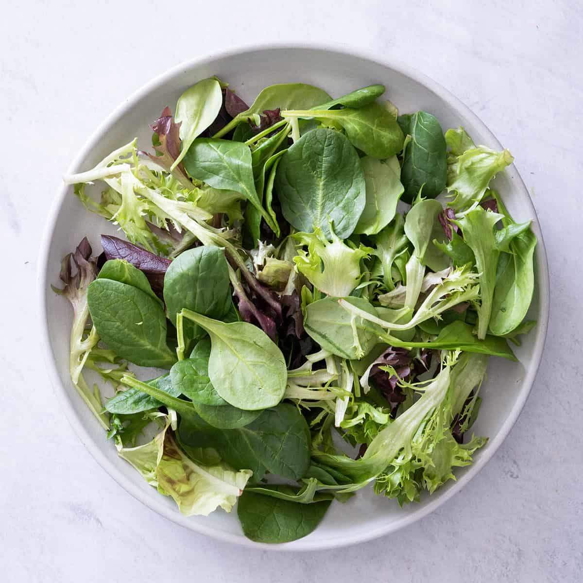 Put the lettuce into a bowl.
