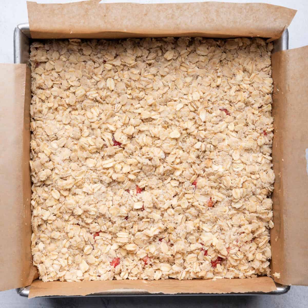 Baking dish topped with crumble mixture.