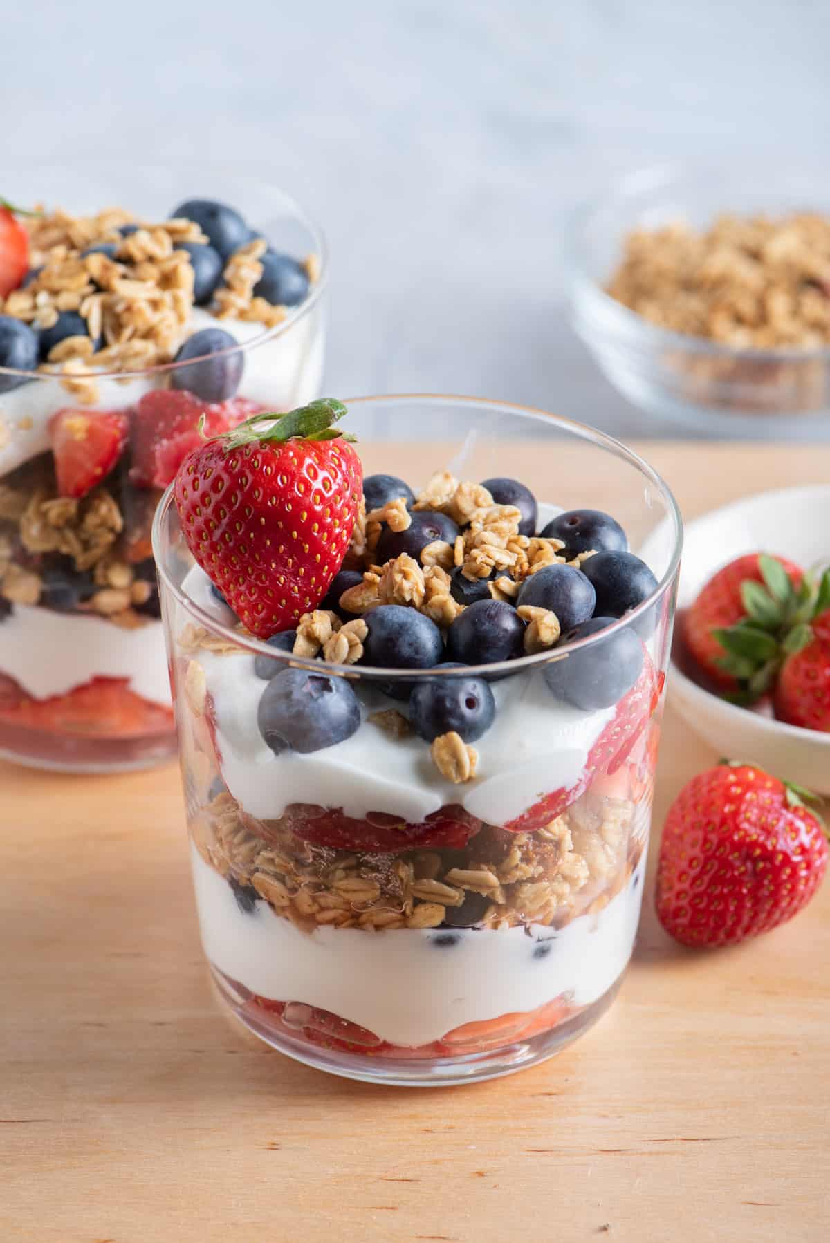 Fruit and yogurt parfait with red, white and blue fruits layered