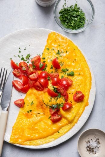 Inside out omelette served with cherry tomatoes on top
