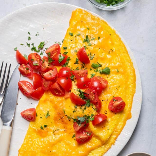 Inside out omelette served with cherry tomatoes on top