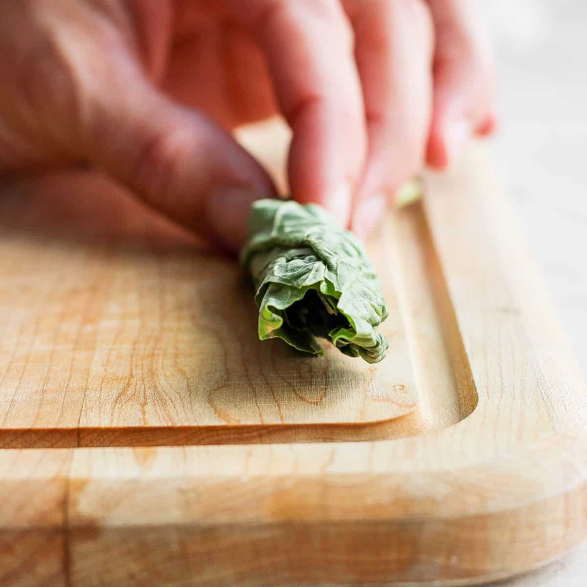 Fully rolled basil leaves.
