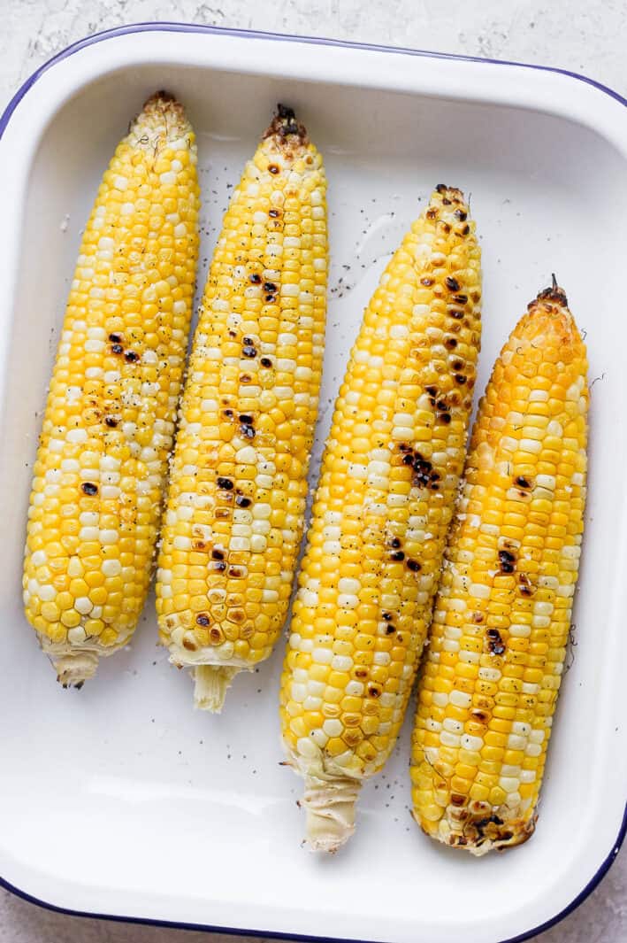 Pan of 4 grilled corn without husks
