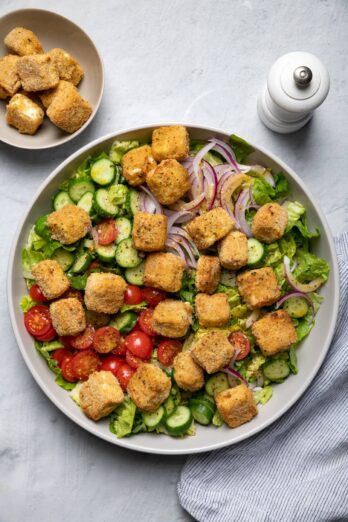 Large bowl of salad with air fried feta cheese croutons