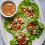Shrimp lettuce wraps on platter served with peanut sauce