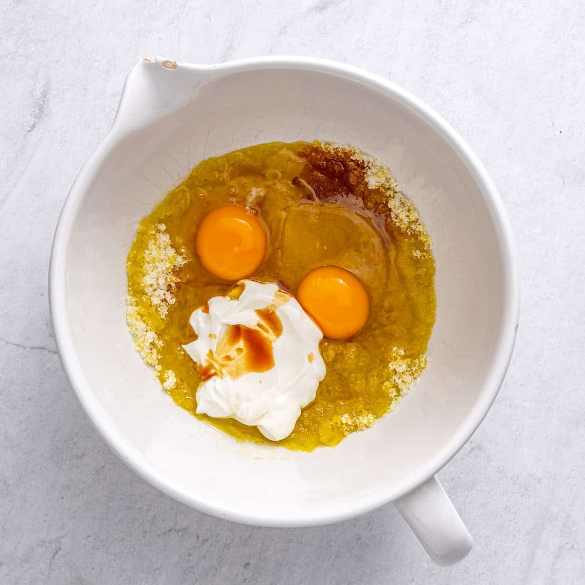Eggs, oil, yogurt, and vanilla added before mixing.