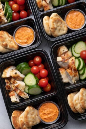 Meal prepped grilled chicken with hummus and veggies