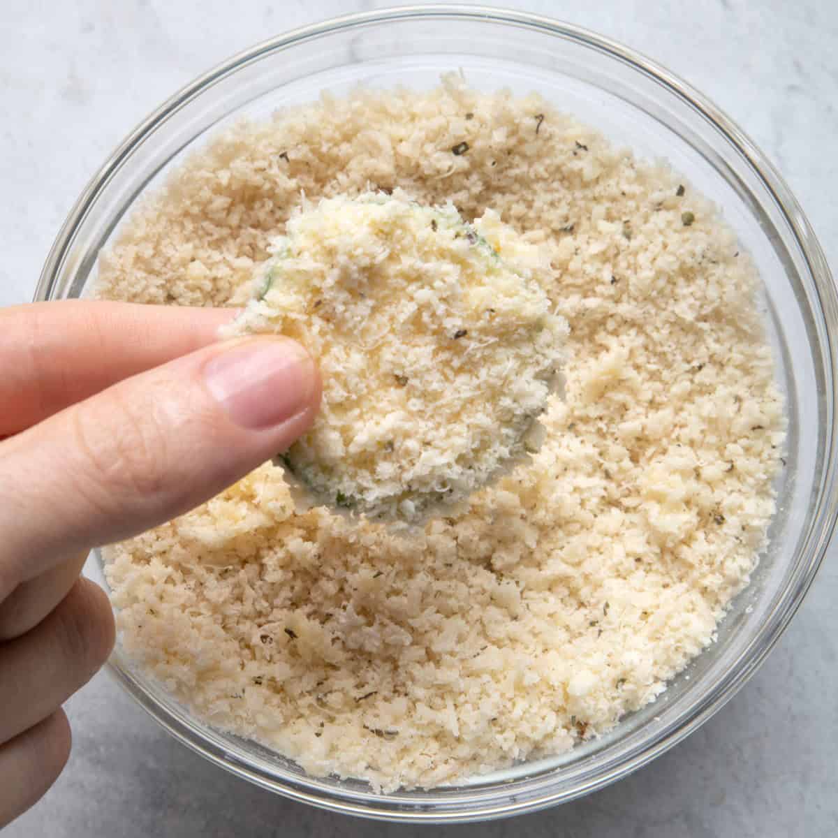 Dip zucchini in bread crumbs mixture.