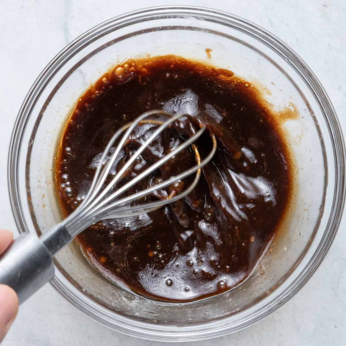 Sauce ingredients being whisked.
