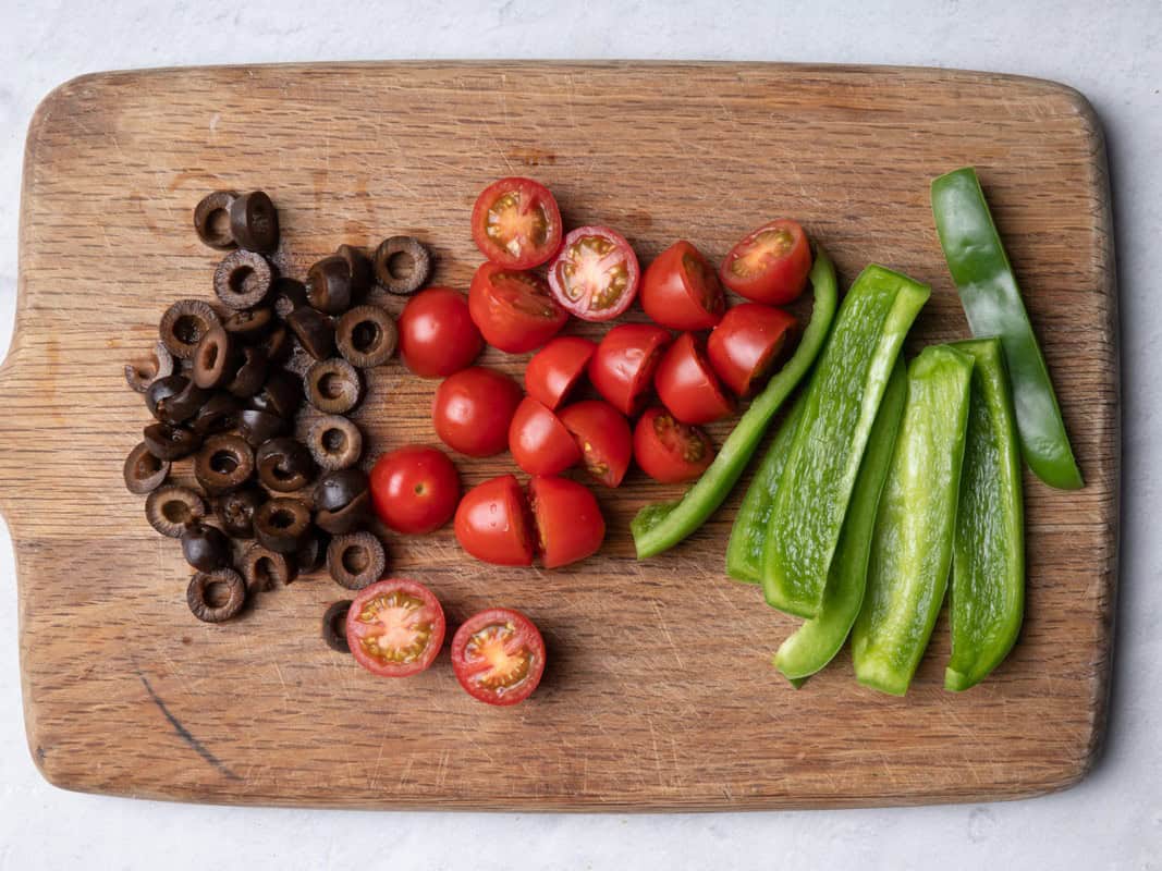 Ingredients prepared on cutting board.