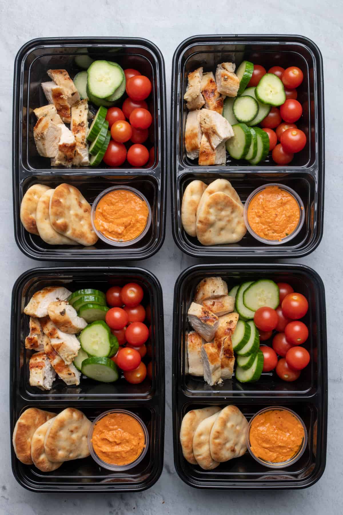 Grilled chicken and hummus meal prep containers