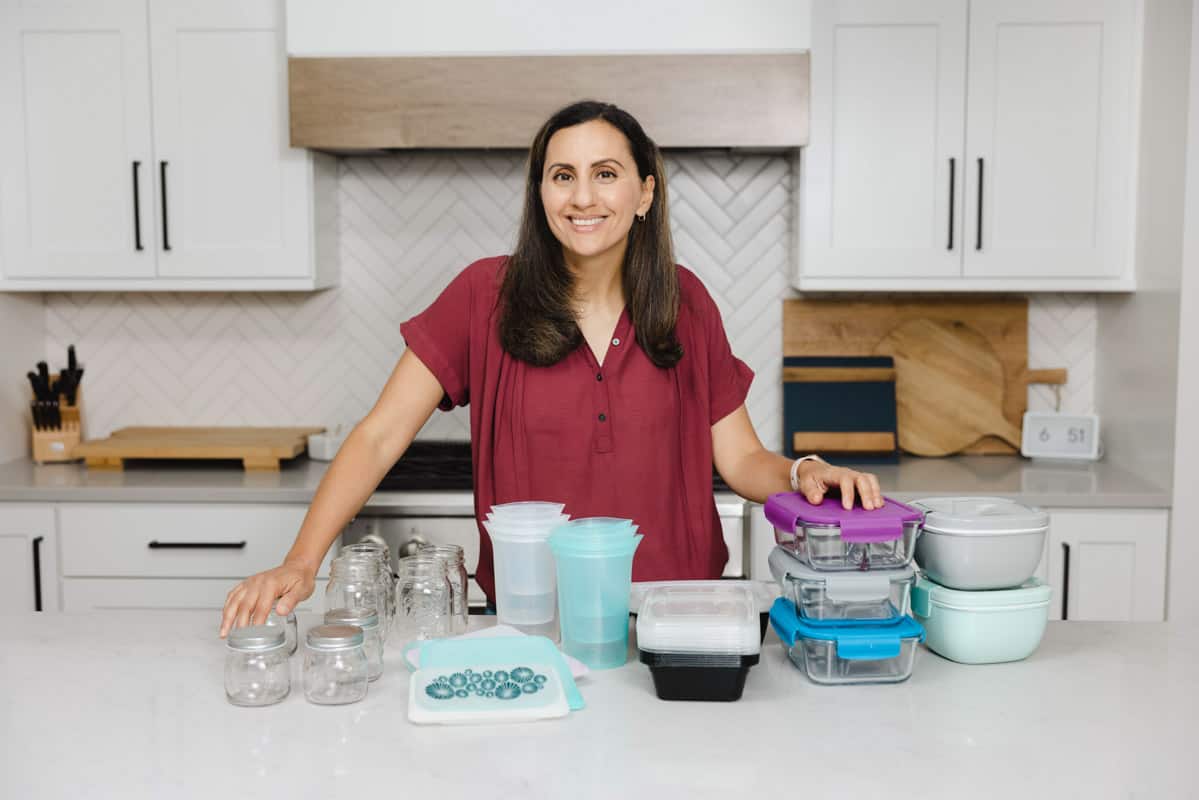 Yumna in kitchen with lots of different meal prep containers on the countertop