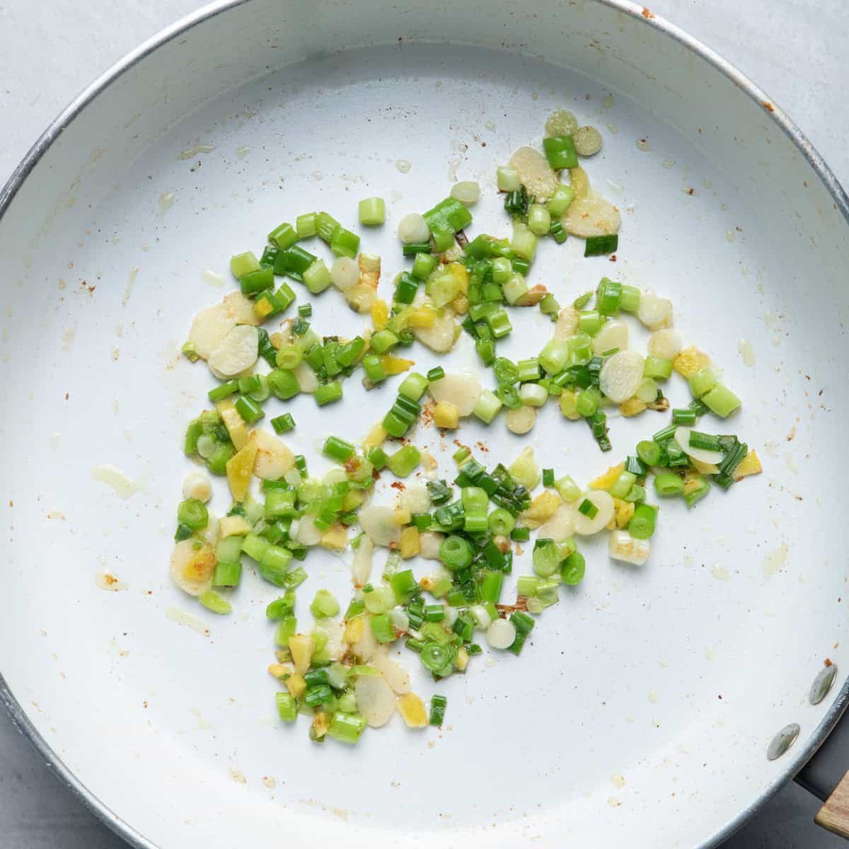 Cooked scallions, garlic and ginger.