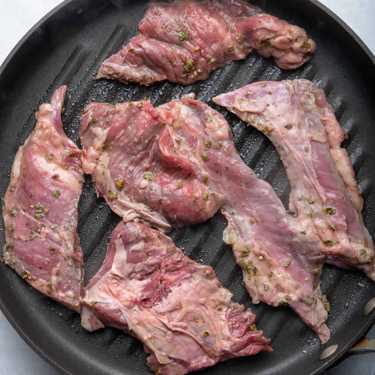 Steak in grill pan before cooking.
