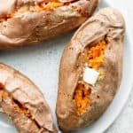 3 baked sweet potatoes with a dab of butter