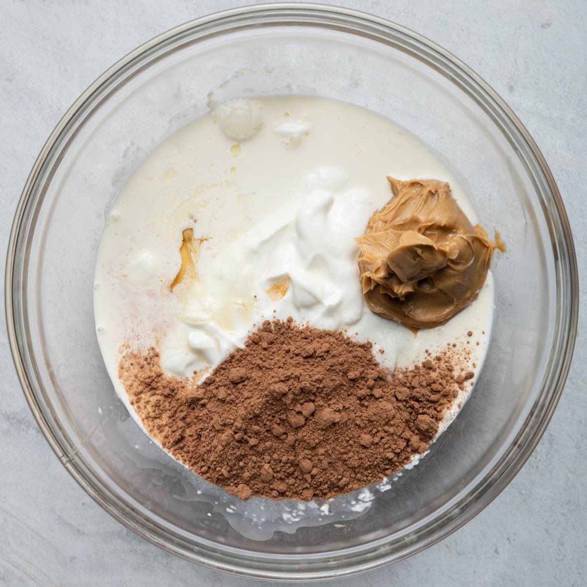 Pudding ingredients in the bowl before mixing.