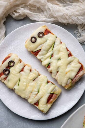 2 mummy pizzas on a plate