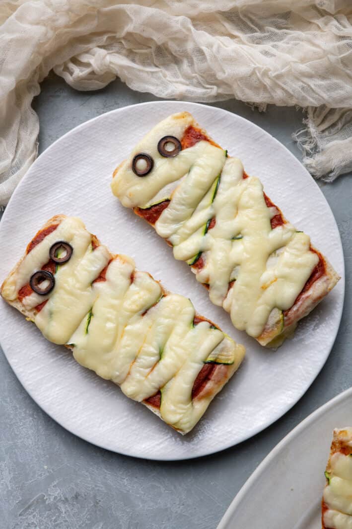 2 mummy pizzas on a plate