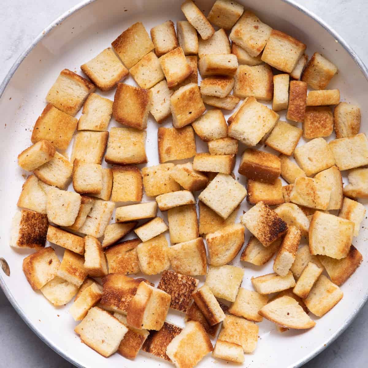 Bread cubes after cooked on skillet.