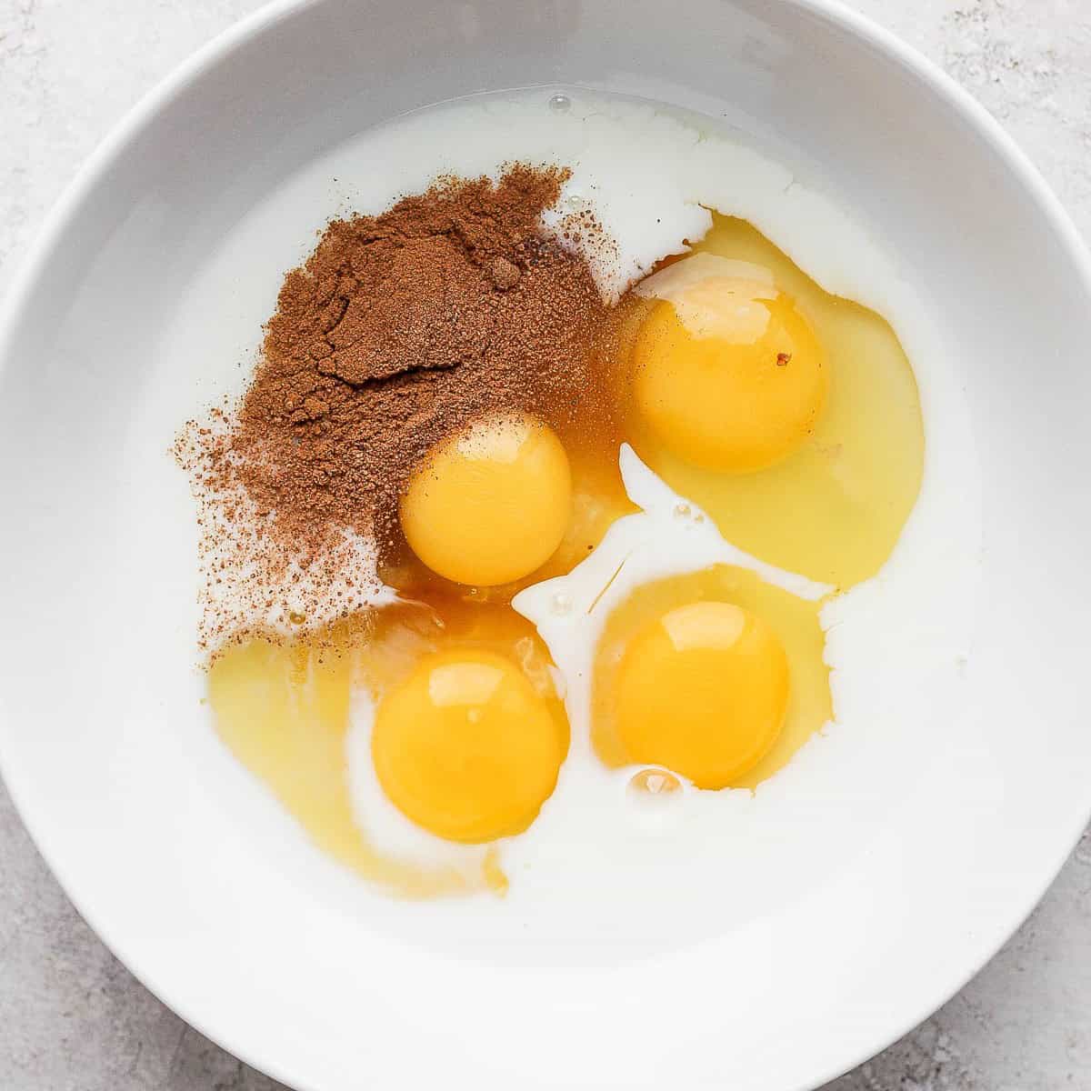 Ingredients for the egg wash in a bowl before mixing.