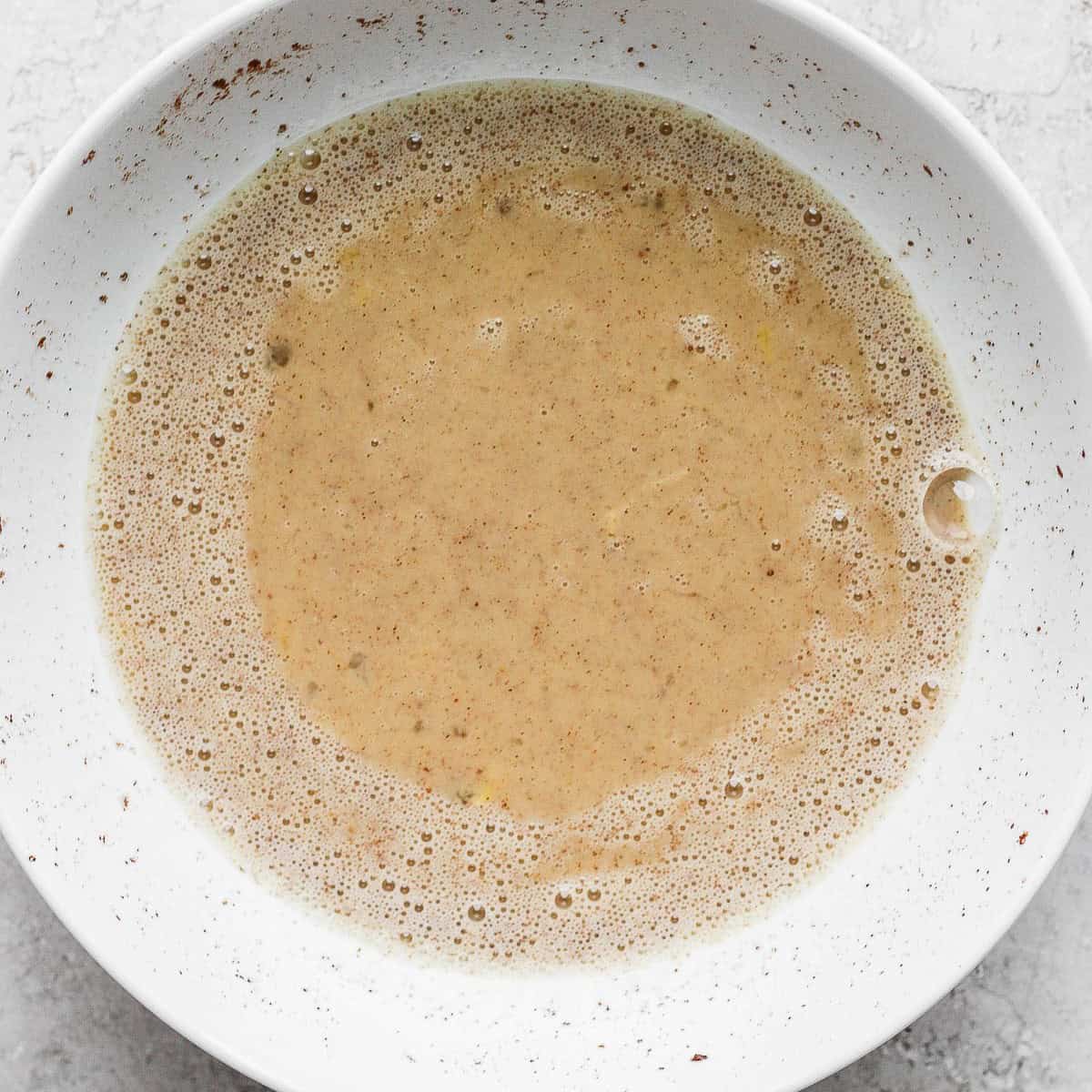 Egg wash mixed together in a bowl.