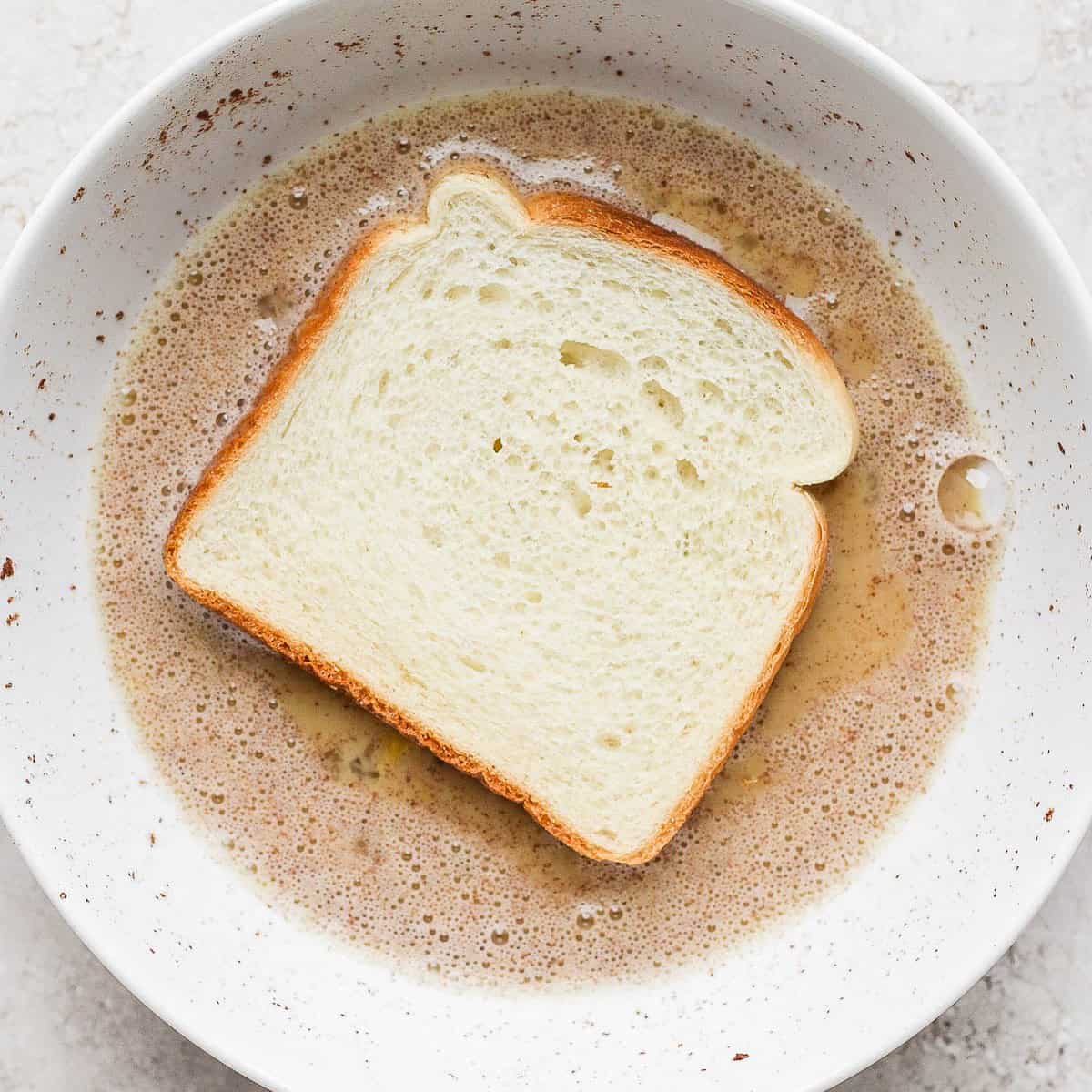 A piece of bread in the bowl.