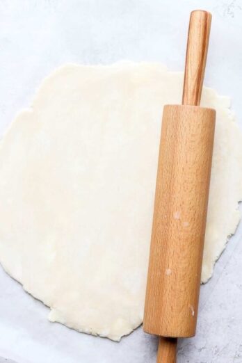 Rolling out pie crust to use in pie recipes