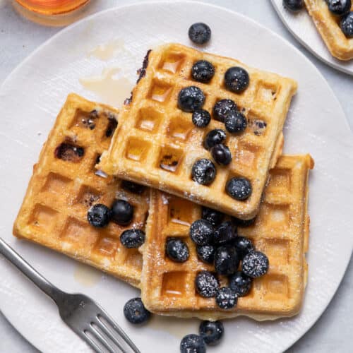Blueberry yogurt waffles on plate with fork